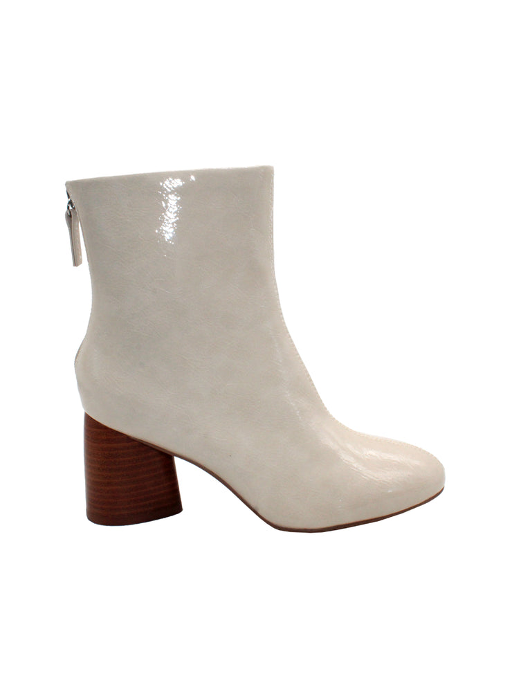 The ‘Alma’ ankle bootie by Sbicca is inspired by heritage looks we made in the 60s and 70s. The textured patent is accented by the metal back zipper with a self-zipper pull. These booties feature padded insoles that rest comfortably on the modern teardrop heel and will pair well with denim and mini dresses.